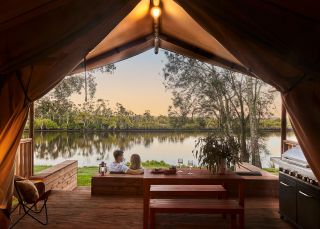 Couple enjoying Myall River Camp, Hawks Nest